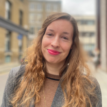 Head and shoulders profile photo of Georgina stood outside the office with street in the background.